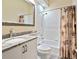 Bathroom featuring a vanity with a granite countertop, a toilet, and a shower with a floral shower curtain at 6316 Walton Heath Pl, University Park, FL 34201