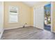 Bedroom featuring sliding glass doors, shuttered windows, and laminate floors at 6316 Walton Heath Pl, University Park, FL 34201
