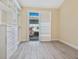 Bedroom featuring sliding glass doors, shuttered windows, and custom built-in closet system at 6316 Walton Heath Pl, University Park, FL 34201