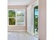 Bedroom with plantation shutters on the windows and sliding door leading to the lanai at 6316 Walton Heath Pl, University Park, FL 34201