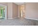 Bedroom features wood-look tile floors, neutral paint, and sliding glass doors to the porch at 6316 Walton Heath Pl, University Park, FL 34201