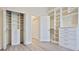 Closet featuring custom built-in storage and laminate floors at 6316 Walton Heath Pl, University Park, FL 34201