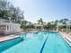 Large, well-maintained community pool with ample seating and clear blue water at 6316 Walton Heath Pl, University Park, FL 34201