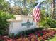 The Whitebridge Court community sign is surrounded by flowers and greenery at 6316 Walton Heath Pl, University Park, FL 34201