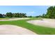 Picturesque golf course showcasing meticulously maintained greens and sand traps at 6316 Walton Heath Pl, University Park, FL 34201