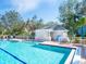 Inviting community pool with a poolside cabana for shade and relaxation at 6316 Walton Heath Pl, University Park, FL 34201
