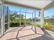 Screened porch with tile floors, enclosure, and a water view at 6316 Walton Heath Pl, University Park, FL 34201