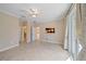 Spacious bedroom with tiled floor, ceiling fan and access to a private balcony at 6857 Wild Lake Ter, Bradenton, FL 34212