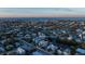 Aerial view showcases the property's location in a charming coastal neighborhood, close to the water at 7003 Holmes Blvd, Holmes Beach, FL 34217