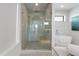 Bright bathroom featuring a glass shower with rain shower head and separate soaking tub at 7003 Holmes Blvd, Holmes Beach, FL 34217