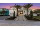 Striking modern home with clean lines, palm trees, and meticulously landscaped front yard at 7003 Holmes Blvd, Holmes Beach, FL 34217