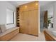 Hallway with built-in storage, bench seating, and natural light, creating a functional and inviting space at 7003 Holmes Blvd, Holmes Beach, FL 34217