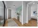 Bright hallway includes an accent rug, storage unit with a beverage cooler and access to the bedroom at 7003 Holmes Blvd, Holmes Beach, FL 34217