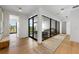 Hallway with wood flooring, glass enclosed living space and natural light at 7003 Holmes Blvd, Holmes Beach, FL 34217