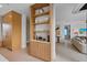 Chic kitchen with open shelving, modern appliances, and seamless integration with the adjacent living areas at 7003 Holmes Blvd, Holmes Beach, FL 34217