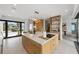 Well-lit kitchen with a large island and modern fixtures and open floorplan at 7003 Holmes Blvd, Holmes Beach, FL 34217