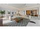 Bright living area with comfortable seating, dining area, and a cohesive design throughout the space at 7003 Holmes Blvd, Holmes Beach, FL 34217