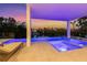 Inviting outdoor pool and spa area with stylish lounge chairs and scenic views at 7003 Holmes Blvd, Holmes Beach, FL 34217