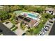 Aerial view of the clubhouse features a pool, hot tub, shuffleboard courts, and solar panels at 7407 29Th Avenue W Dr # 2288, Bradenton, FL 34209
