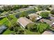An aerial view features a pond and neighboring houses and the property's covered parking space at 7407 29Th Avenue W Dr # 2288, Bradenton, FL 34209