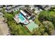 Aerial view showcases community amenities: a pool, hot tub, shuffleboard court, and lounge area at 7407 29Th Avenue W Dr # 2288, Bradenton, FL 34209