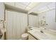 Bathroom featuring a standard toilet, a single sink vanity and a bathtub with shower at 7407 29Th Avenue W Dr # 2288, Bradenton, FL 34209