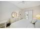 Bright bedroom with white furnishings, vaulted ceiling and sliding glass doors to the lanai at 7407 29Th Avenue W Dr # 2288, Bradenton, FL 34209