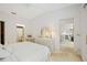 Bright bedroom featuring light-colored carpet, white walls and vaulted ceiling at 7407 29Th Avenue W Dr # 2288, Bradenton, FL 34209