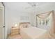 Cozy bedroom with light pink furnishings, including bedspread, curtains, and rug at 7407 29Th Avenue W Dr # 2288, Bradenton, FL 34209