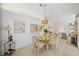 Dining room featuring a glass-topped table and four chairs, along with a wine rack at 7407 29Th Avenue W Dr # 2288, Bradenton, FL 34209