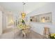 Dining area with neutral colors, pendant lighting, and a view of the kitchen and bedroom at 7407 29Th Avenue W Dr # 2288, Bradenton, FL 34209