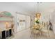 Bright dining room with a glass-topped table and sliding doors to the lanai at 7407 29Th Avenue W Dr # 2288, Bradenton, FL 34209