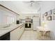 Bright kitchen with white cabinets, appliances, and an eat-in area, ready for meal preparation at 7407 29Th Avenue W Dr # 2288, Bradenton, FL 34209