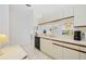 The kitchen features white cabinets, a view of the dining area, and modern appliances at 7407 29Th Avenue W Dr # 2288, Bradenton, FL 34209