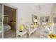 Enclosed lanai featuring white wicker furniture, tile floors and access to bedroom at 7407 29Th Avenue W Dr # 2288, Bradenton, FL 34209