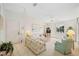 A spacious living room with a view of the entry and large windows letting in natural light at 7407 29Th Avenue W Dr # 2288, Bradenton, FL 34209
