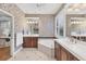 Bathroom featuring a soaking tub, double vanity, and a separate walk-in shower at 7665 Portstewart Dr, Lakewood Ranch, FL 34202