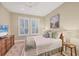 Bedroom with natural light, neutral decor, and carpet floors at 7665 Portstewart Dr, Lakewood Ranch, FL 34202