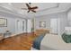 Bright and airy main bedroom featuring hardwood floors and french doors at 7665 Portstewart Dr, Lakewood Ranch, FL 34202