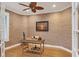 Private home office with neutral walls, a ceiling fan, and hardwood floors at 7665 Portstewart Dr, Lakewood Ranch, FL 34202