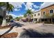 A picturesque view of downtown featuring a street with shops, trees, and vibrant landscaping at 7665 Portstewart Dr, Lakewood Ranch, FL 34202
