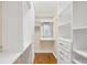 Organized walk-in closet with multiple shelves and drawers at 7665 Portstewart Dr, Lakewood Ranch, FL 34202