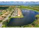 Beautiful aerial view of condo community with lake and preserves at 7911 Grand Estuary Trl # 102, Bradenton, FL 34212