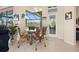 Cozy breakfast nook featuring a glass table and views to the outside at 803 Coral Bean Cv, Venice, FL 34293