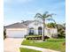 Charming single Gathering home featuring a tile roof, manicured landscaping, and a two car garage at 803 Coral Bean Cv, Venice, FL 34293