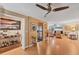 Inviting living room boasts hardwood floors, a ceiling fan, and an open layout perfect for entertaining at 8140 Terrace Garden N Dr # 103, St Petersburg, FL 33709