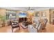 Comfortable living room featuring hardwood floors, stylish furnishings, and plenty of natural light at 8140 Terrace Garden N Dr # 103, St Petersburg, FL 33709