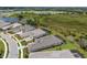 Aerial shot of multiple homes in the neighborhood backing up to the wooded area at 8364 Sea Glass Ct, Sarasota, FL 34240