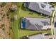 Expansive aerial view showcases the luxurious home, pool, and lush landscaping at 8364 Sea Glass Ct, Sarasota, FL 34240