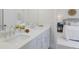 Bright bathroom with large vanity with dual sinks located off the main bedroom at 8364 Sea Glass Ct, Sarasota, FL 34240